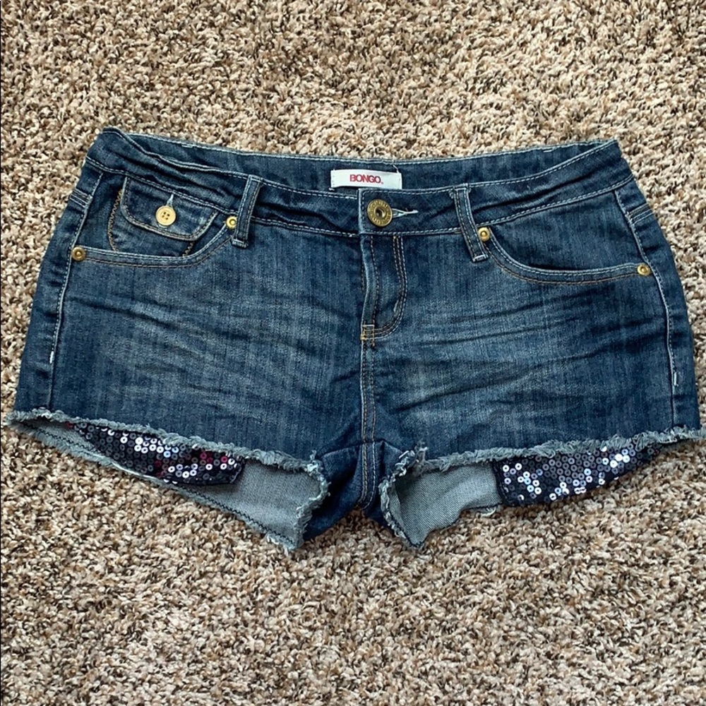 BONGO jean shorts. Sequined pocket hang below hem